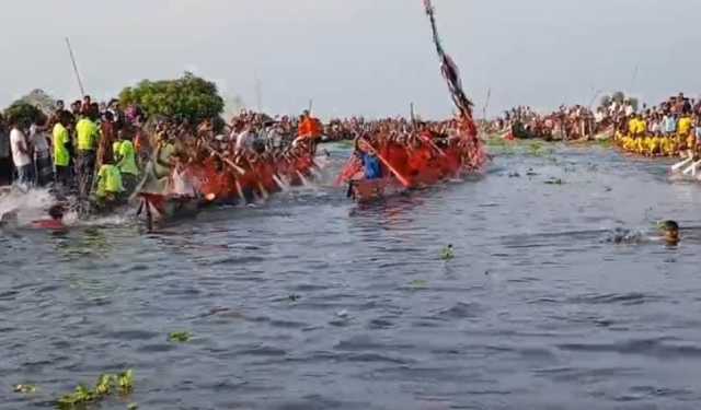 নৌকা বাইচ দেখতে আড়িয়াল বিলে হাজারো জনতার ঢল