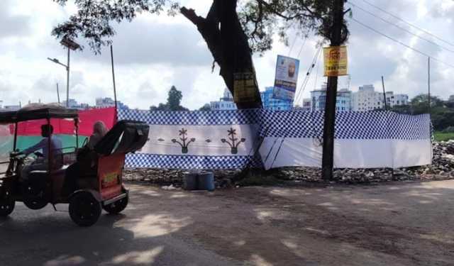 উপদেষ্টার সম্মানার্থে পর্দায় ঢাকা হলো আবর্জনার স্তূপ