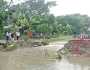 লক্ষ্মীপুরে বৃষ্টি-জোয়ারে সড়ক বিচ্ছিন্ন, মানুষের দুর্ভোগ
